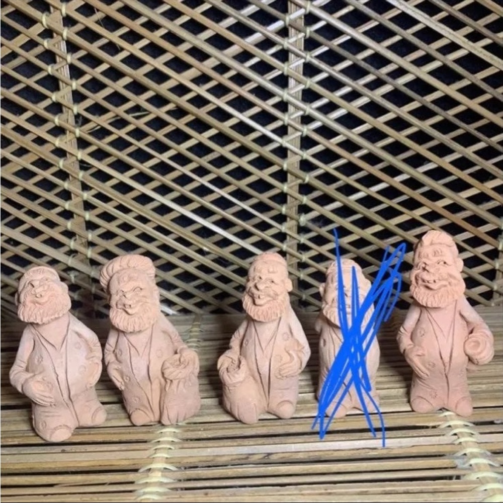 Handmade pottery men signed by artist